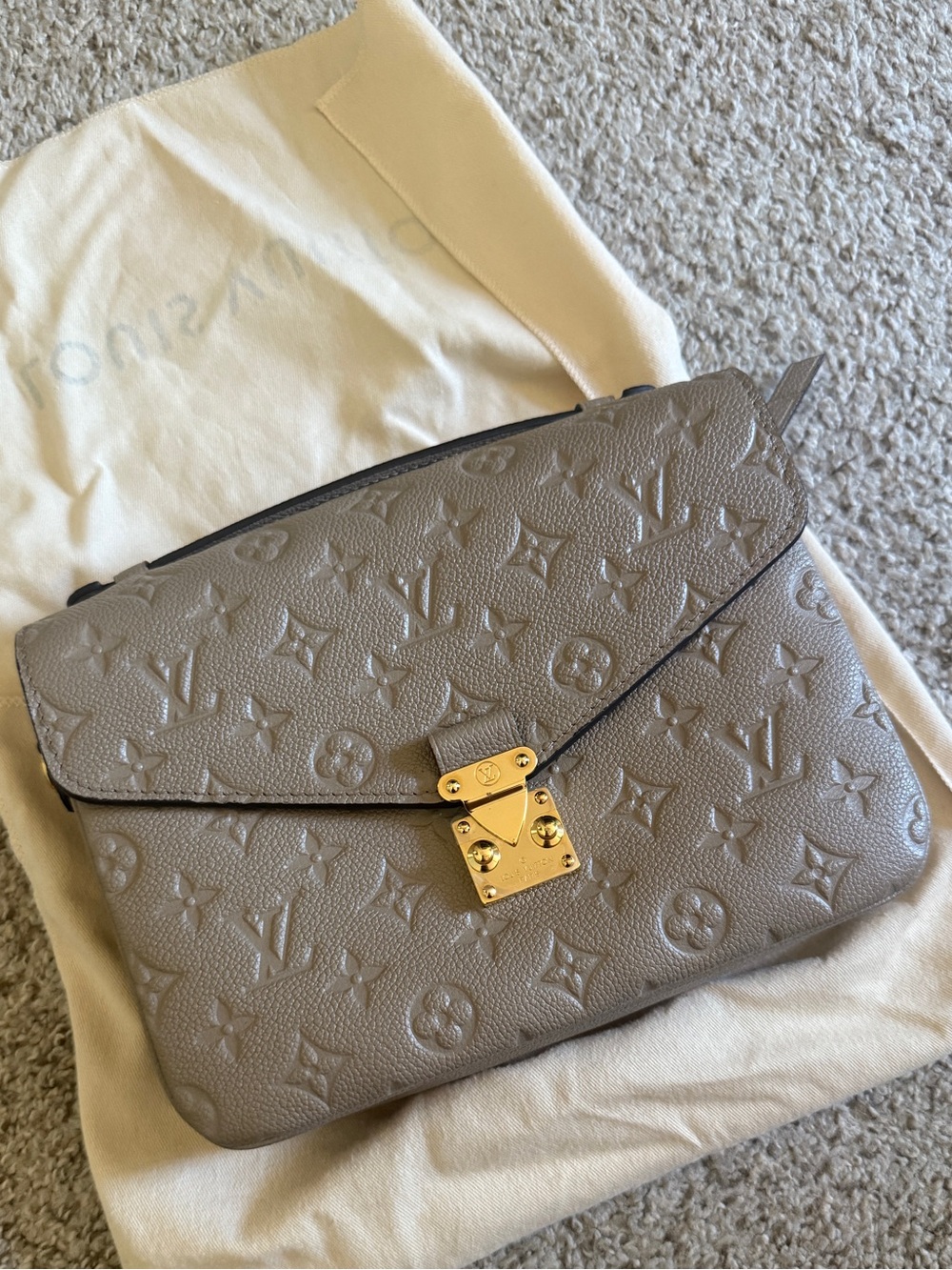 Louis Vuitton Taupe Monogram Embossed Pochette with Gold-Tone Lock